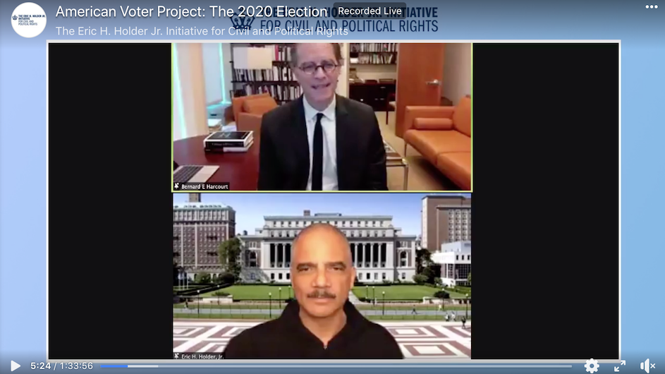 An image from a Zoom webinar of a man with glasses wearing a suit and a man with a mustache wearing a dark shirt